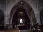 Interior de la Iglesia de Nuestra Señora de Rocamador. Retablo con una escultura de un Cristo tallado atribuído a José de Churriguera